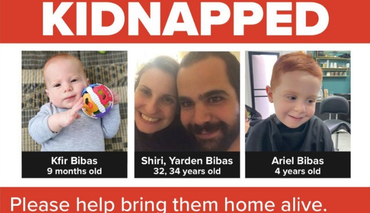 Poster titled KIDNAPPED showing three photos with captions: Kfir Bibas (9 months), Shiri Bibas (32), Yarden Bibas (34), and Ariel Bibas (4), with a plea to bring them home alive.