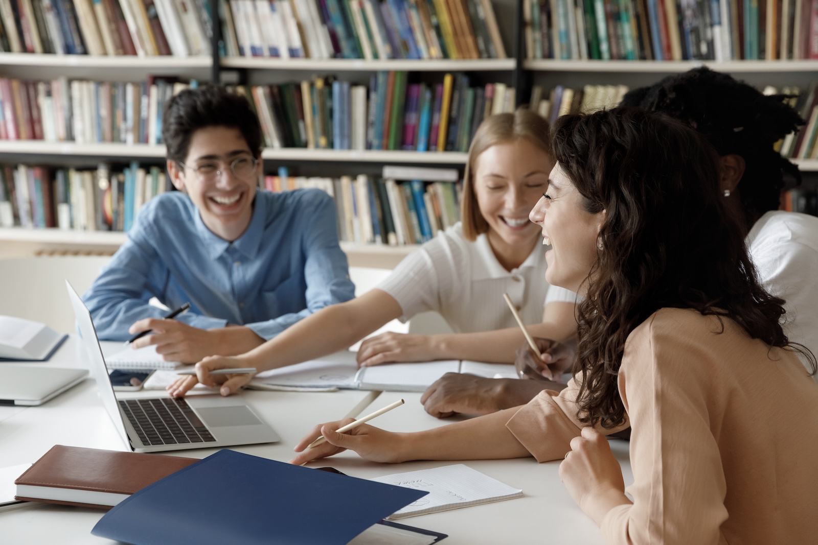 Diverse students studying together in a Jewish educational space.